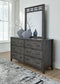 Montillan King Panel Bed with Mirrored Dresser and Nightstand